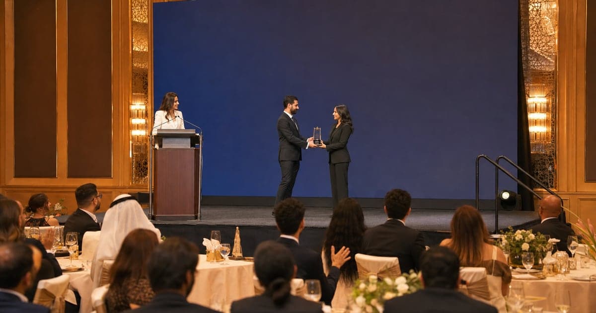 Bilingual MC hosting an awards ceremony in a Dubai hotel ballroom.